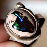 A thousand fires, reflection ring in silver and fire opal