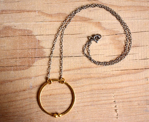 Gold enclosure, circle of the couple necklace in gold and sterling silver