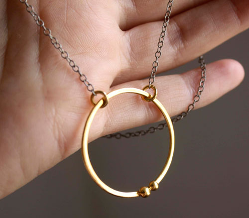 Gold enclosure, circle of the couple necklace in gold and sterling silver