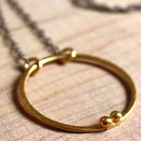 Gold enclosure, circle of the couple necklace in gold and sterling silver