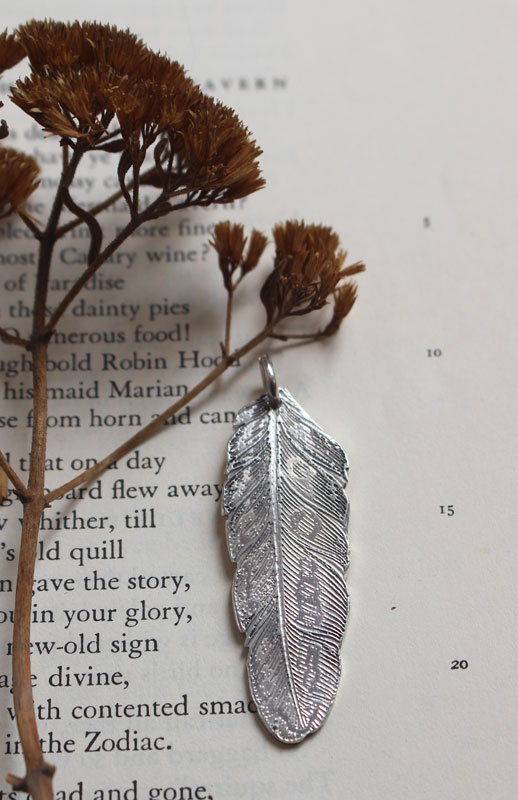 Feather, peace and freedom pendant in silver