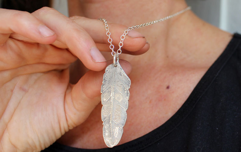 Feather, peace and freedom pendant in silver