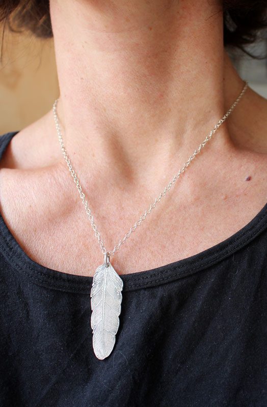 Feather, peace and freedom pendant in silver