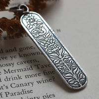 Messenger of life, bird and flower pendant in silver