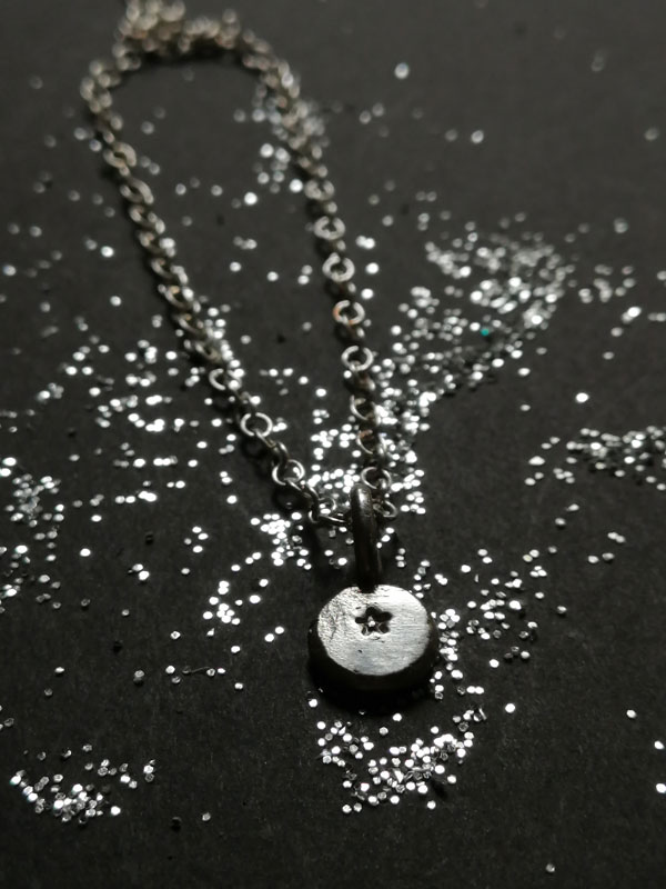 Ray of hope, small star necklace in sterling silver