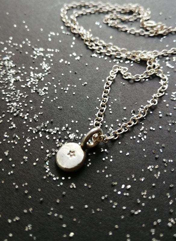 Ray of hope, small star necklace in sterling silver