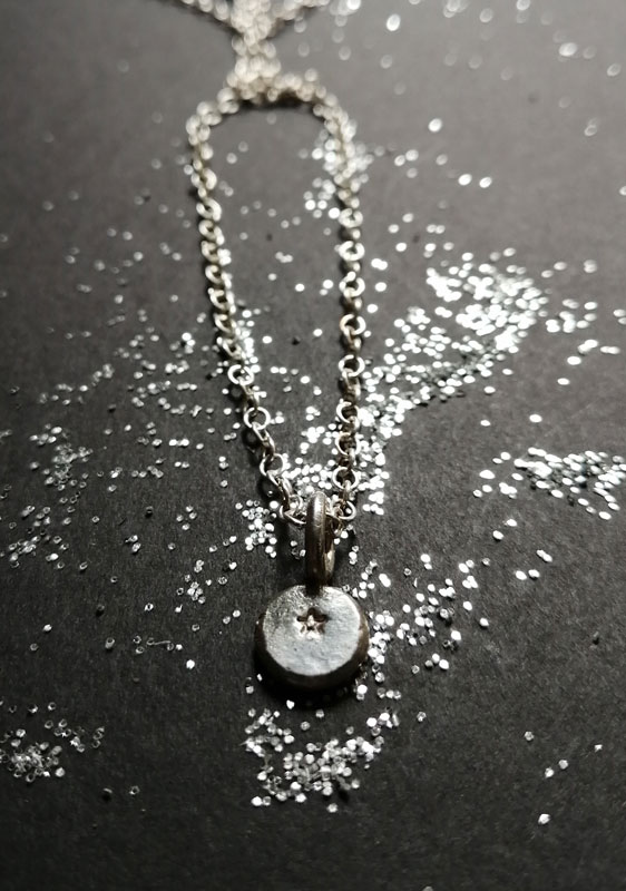 Ray of hope, small star necklace in sterling silver