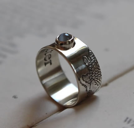 Ring engraved with a Japanese carp and a moonstone.