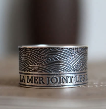 Custom order for a ring engraved with a quote and the raging sea